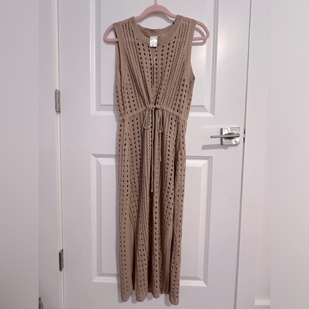 NewWithTags Large bathing suit cover up. Ties in the middle to create cute shape